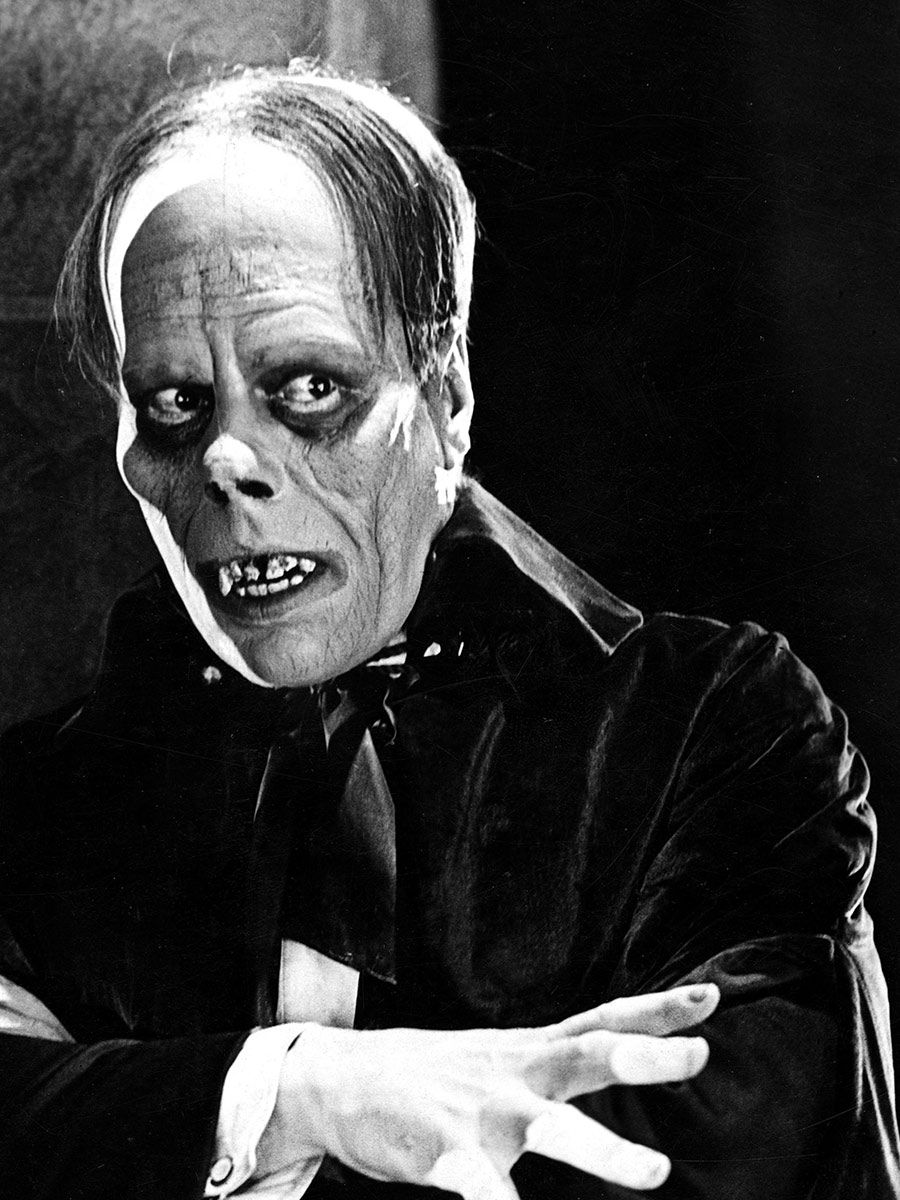 Black and White photo of Lon Chaney as The Phantom of the Opera in the original 1929 silent film